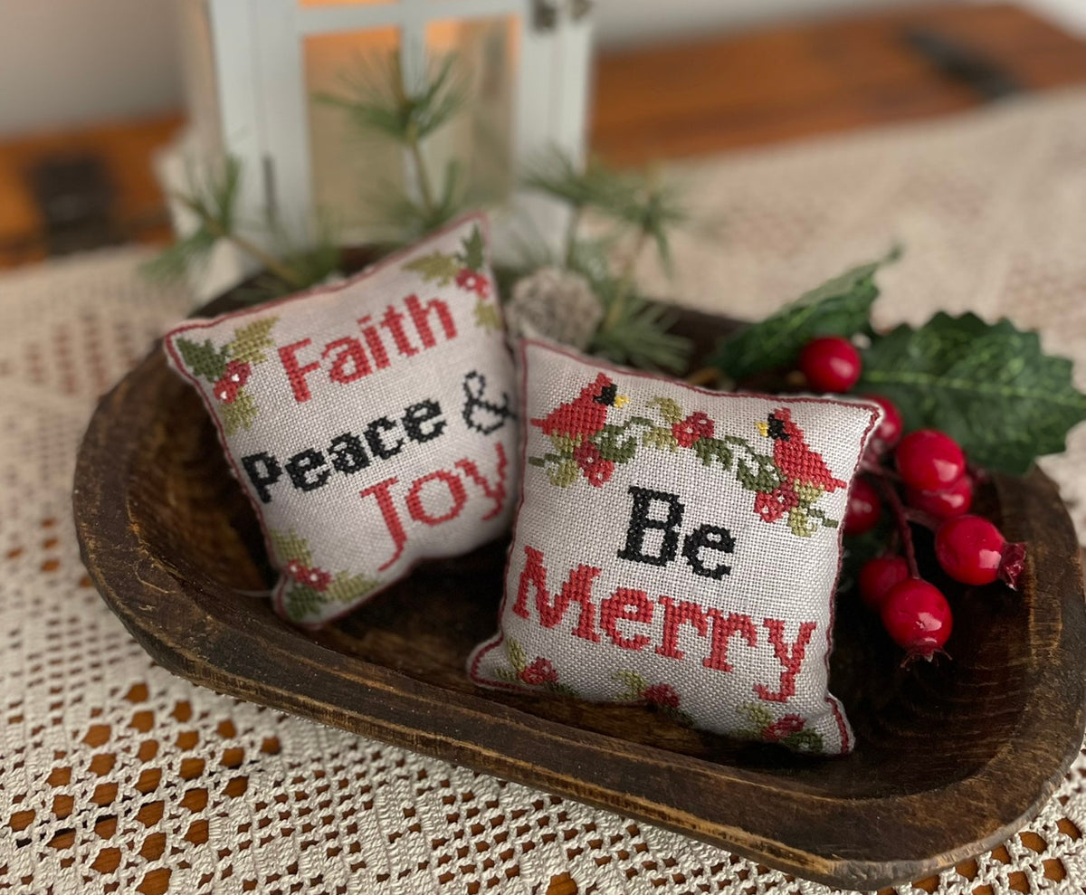 Merry and Faith Pillows by Mani di Donna